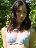 Long haired asian beauty shows her round tits in forest here