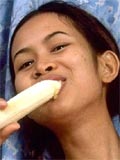 Naughty little asian slut eats banana and open her pussy wide