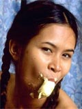 Naughty little asian slut eats banana and open her pussy wide