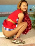 asian in a cheerleader uniform shows her tits and shaved pussy