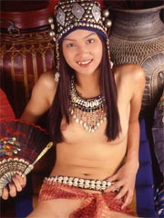 Asian teen plugs a cucumber in her tight twat