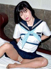 Lovely japanese coed in uniform spreads her tight trimmed pussy here