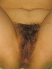 Naked Asian amateur wife opens her legs wide to show her hairy pussy