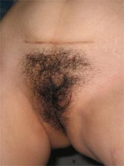 Naked Asian amateur wife opens her legs wide to show her hairy pussy