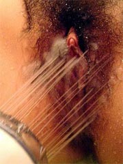Asian amateur babe takes a shower and spreads wide her pussy