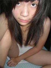 Lovely Asian teen shows her tight pussy here